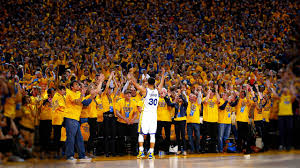 Fans cheering at a basketball game